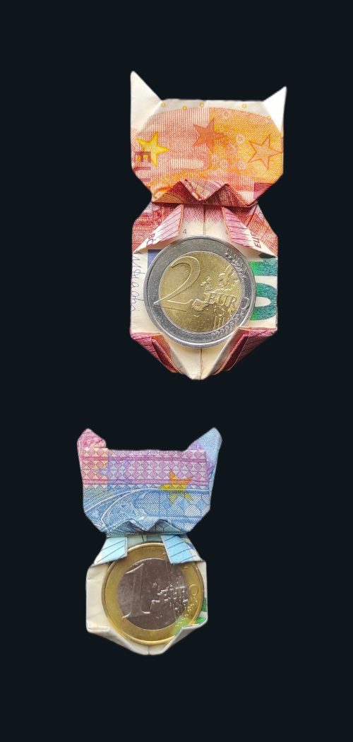 Cats folded from euro bills using origami technique